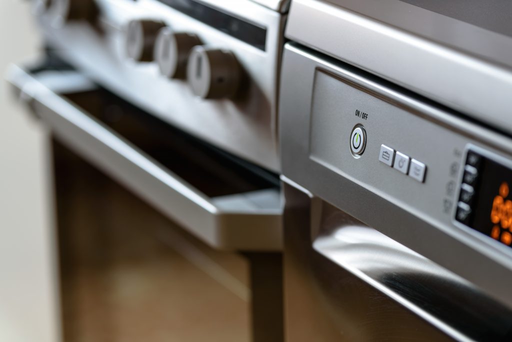 Metallic stove and dishwasher in the kitchen, where thermal management solutions are needed, such as mica