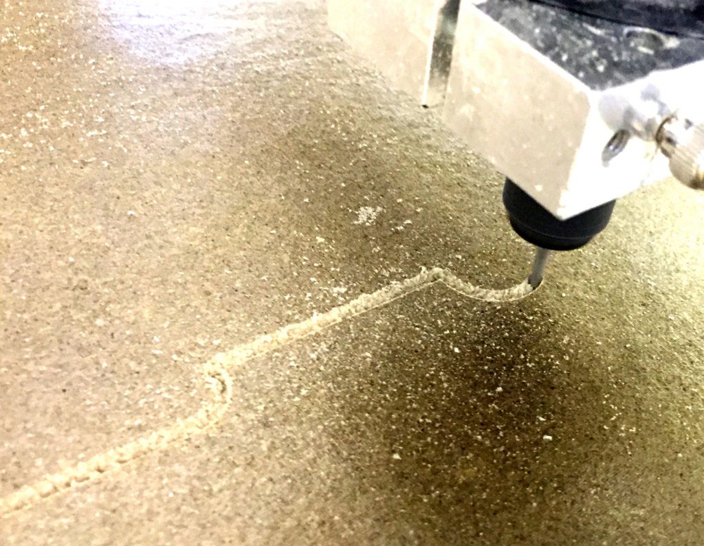 Mica sheet being cut by electric saw for thermal management