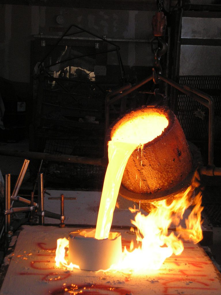 Foundry crucible pouring molten metal into mould for blog by Emelin on furnace insulation basics