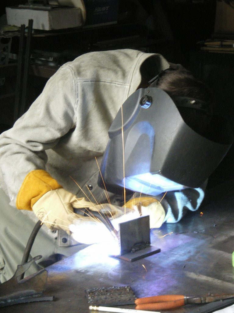 a welder making a prototype