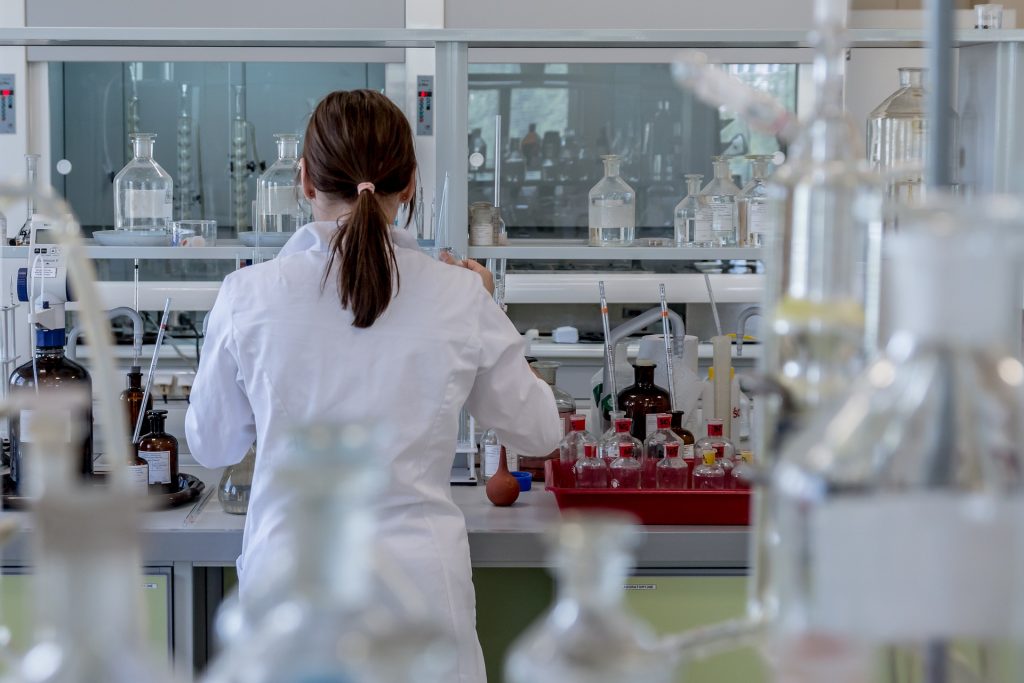 woman in a lab coat for blog by Elmelin on tax breaks for R&D